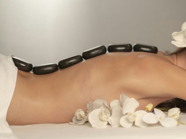Guest relaxing during a hot stone massage